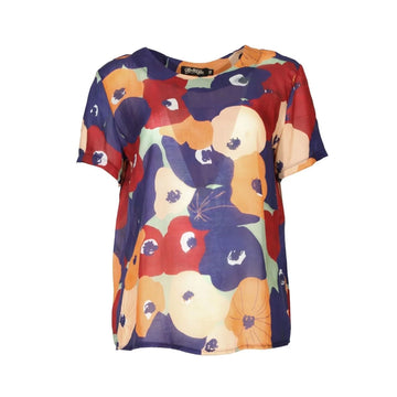 A women's short sleeve top printed with a colourful floral design.