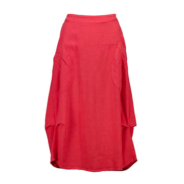 A linen skirt in watermelon pink with side pockets and a tuck on either side.