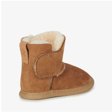 Side view of a baby sized ugg boot in chestnut brown with a velcro strap.