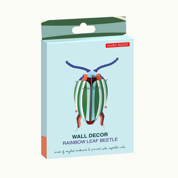 Colorful beetle 3D coloured cardboard model on a white background.