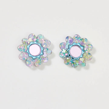 A pair of floral stud earrings with a light purple centre and glitter edges.