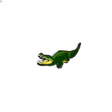 A metal hat badge shaped like a crocodile.