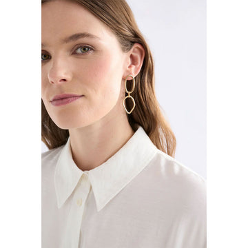 Silver hoop earrings on a light gray background.
