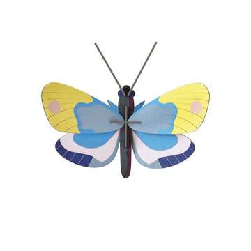 Butterfly-shaped 3D carboard model with yellow, blue, and white wings on a white background