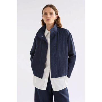 Navy blue linen jacket on a white background.