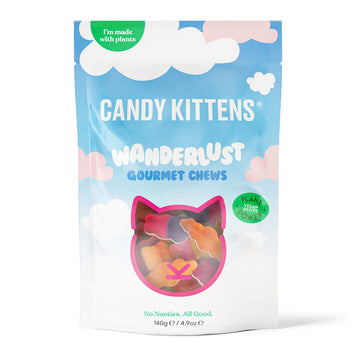 Candy Kittens Wanderlust Gourmet Chews packaging with a blue sky and cloud design and a cat shaped cut out showing the lollies inside.