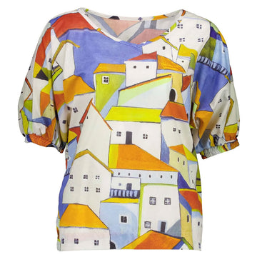 Front view of women's short sleeve top illustrated with colourful houses.