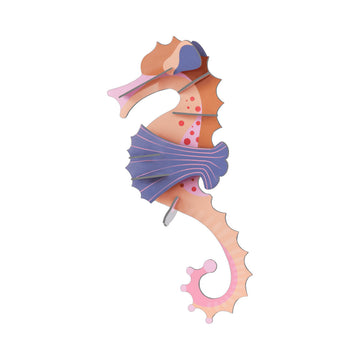Colorful seahorse-shaped 3D carboard model on a white background.