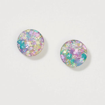 A pair of circle stud earrings in purple and green pastel glitter.