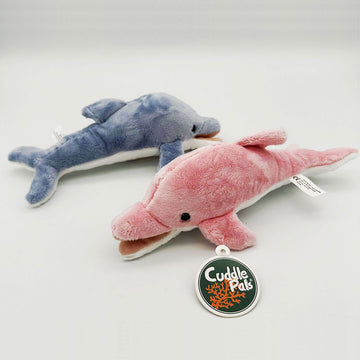 Two dolphin soft toys pictured showing two different sides. One is blue and the other is pink.