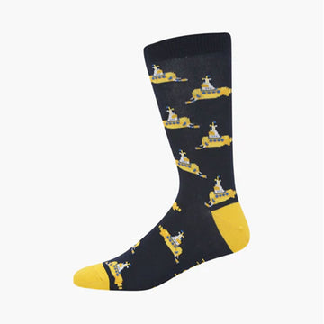 A dark navy sock with a yellow heel and toe and illustrated with yellow submarines.