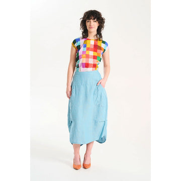 A light blue linen skirt with side pockets.