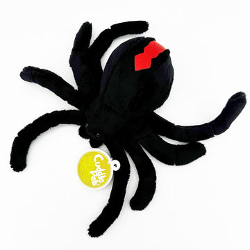 A red back spider soft toy with a tag attached and the text 'Cuddle Pals'.