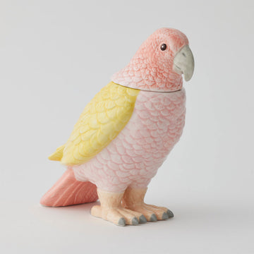 A ceramic jar shaped like a bird in yellow and pink.