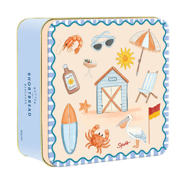A square tin with illustrations from the beach including a crab, umbrella, pelican and beach chair.