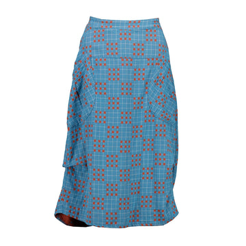 Front view of a blue skirt with an orange grid pattern and side pockets.
