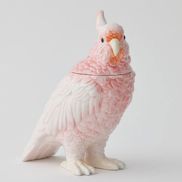 A ceramic jar shaped like a pink bird.