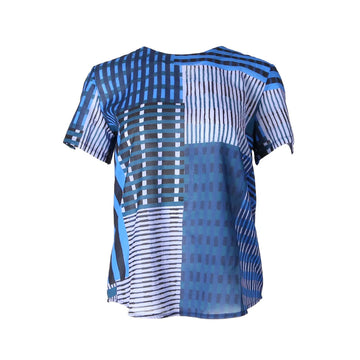 A women's top printed with a blue patchwork print.