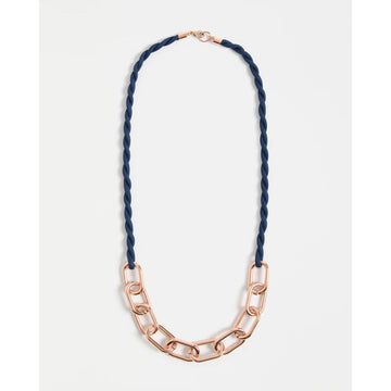 Necklace with rose gold chain and blue braided cord on a white background.