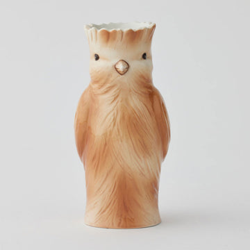 A ceramic vase shaped like a brown bird.