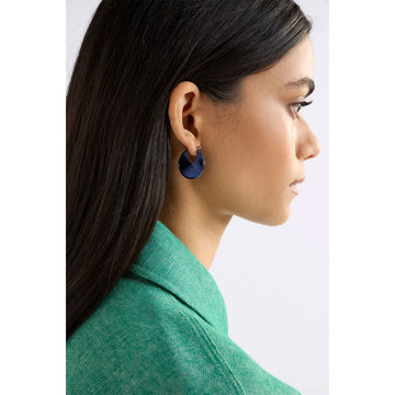 Green hoop earrings on a white background.