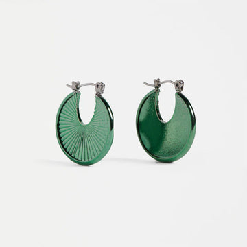 Green hoop earrings on a white background.