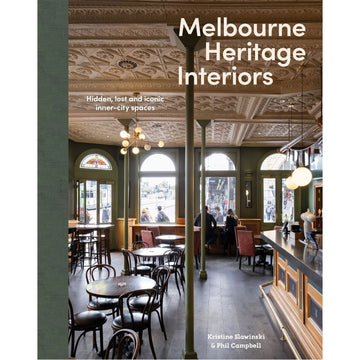 Book cover of 'Melbourne Heritage Interiors' with an interior photo of a cafe.