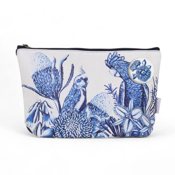 Front view of a cotton travel pouch illustrated with birds and flowers in blue.