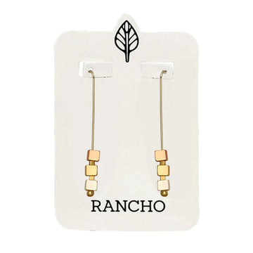Pair of gold and silver beaded earrings on a Rancho branded card.