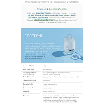 Skincare serum bottle with a white cap on a light gray background.