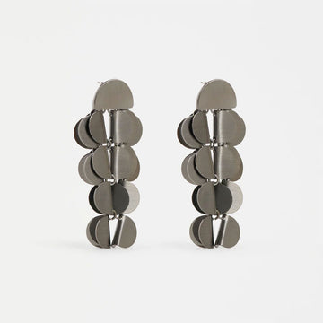 Pair of silver disc earrings on a white background.