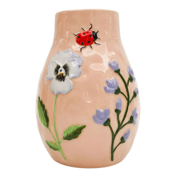 A ceramic vase in light pink with an embossed ladybug and flowers.