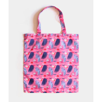 A reusable shopping bag in pink illustrated with a repeat pattern of galahs.