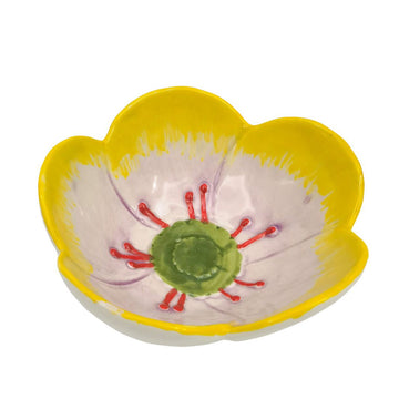 Top down view of a flower shaped ceramic bowl in yellow.