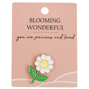 A daisy shaped pin attached to a card with the heading 'Blooming Wonderful'.