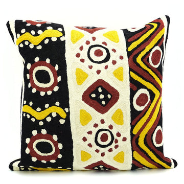 A square cushion printed with artwork  in brown, cream, yellow and black.