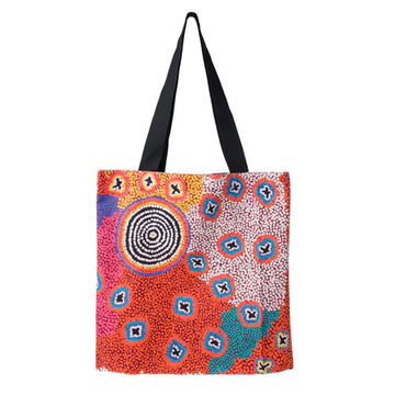 Colorful tote bag with abstract pattern on a white background.