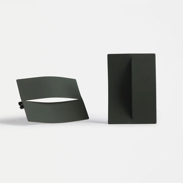 Two large olive green stud earrings on a white background.