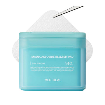 A blue container with white text and a white make up pad behind.