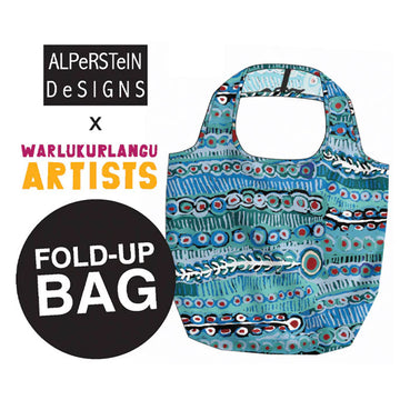 Fold-up bag with Aboriginal art design, featuring ALPerSTEIN DESIGNS and WARLUKURLANGU ARTISTS branding.