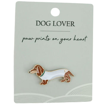 A sausage dog shaped pin attached to a card with the heading 'Dog Lover'.