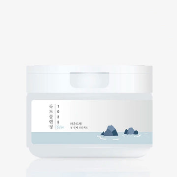 A tub with a label with Korean text and an illustration of rocks on a white background.