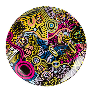 A round ceramic plate printed with colourful artwork by Justin Butler.