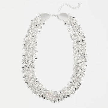 Silver necklace with a textured design on a white background.