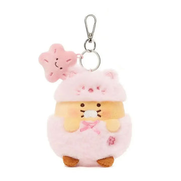 A plush keyring with wearing a pink costume.