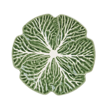 An image of a green plate in a cabbage design.