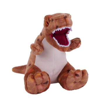 A t rex shaped soft toy in a sitting position.