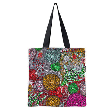 Tote bag with a colorful abstract design on a white background.