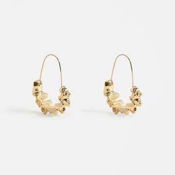 Gold hoop earrings on a white background.