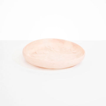 Top and side view of a shallow bowl made from light rose pink resin.